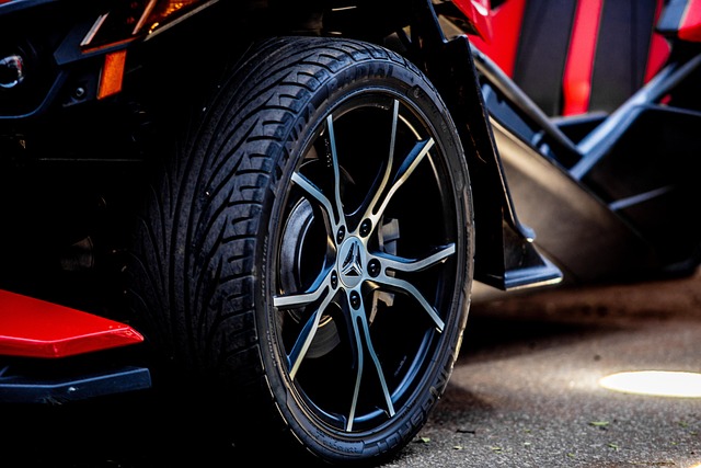 Close-up of a car wheel and tire showing proper alignment and tread pattern for safe driving.
