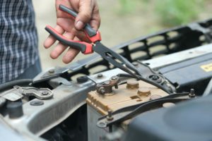 a mechanic providing battery services for Car Service Dandenong